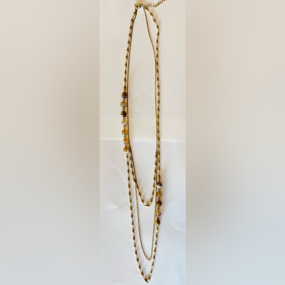 Elegant layered gold chain necklace with marbled accent beads